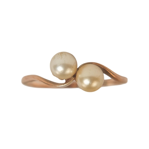 597 - A 9ct gold pearl set ring with crossover setting - size N, 1.3g.