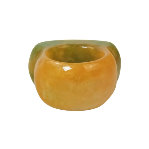 610 - A jadeite archers ring - with rectangular carved face.