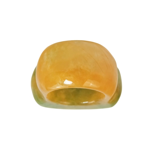 610 - A jadeite archers ring - with rectangular carved face.