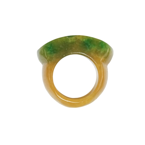 610 - A jadeite archers ring - with rectangular carved face.