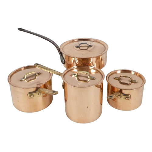 67 - A set of four copper saucepans - lidded, three with brass handles and one with iron. (4)