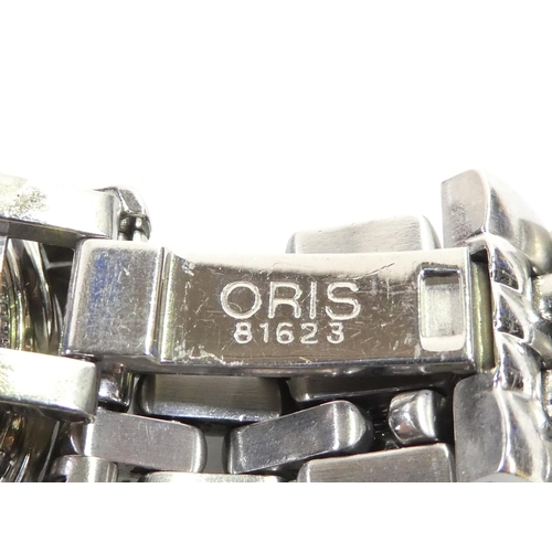 701 - An Oris automatic wristwatch - with steel case and strap with deployant clasp, the black dial set ou... 