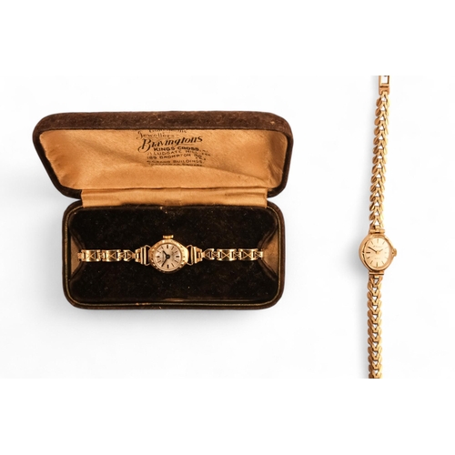 704 - A ladies 9ct gold cocktail watch - oval with a cream dial set out in baton numerals, 10.2g all in, t... 