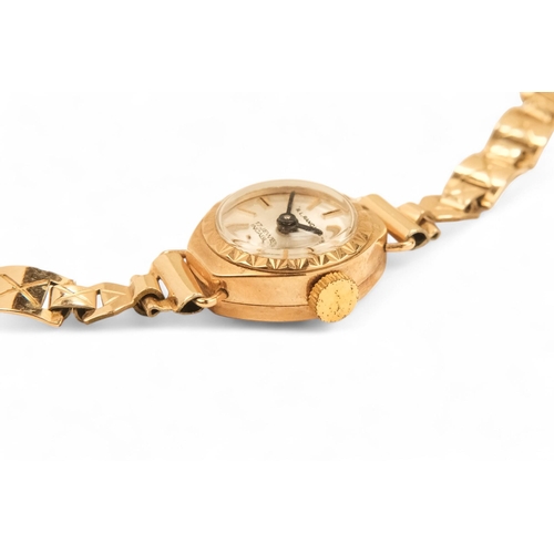 704 - A ladies 9ct gold cocktail watch - oval with a cream dial set out in baton numerals, 10.2g all in, t... 