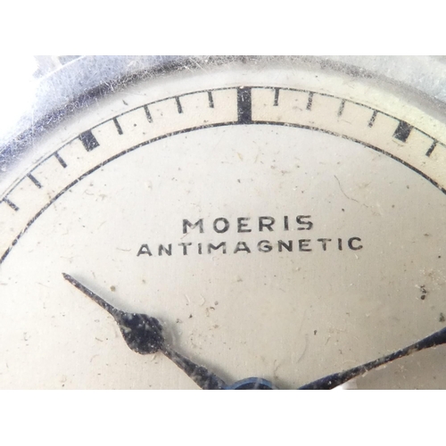 706 - A 20th century Moeris pocket watch - open face with exhibition movement within a chrome case, togeth... 