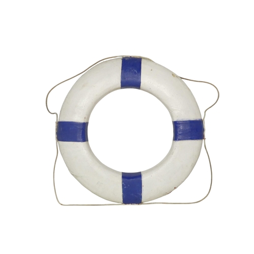 82 - A vintage Perry lifebuoy - canvas covered cork, painted white and blue with a rope band, 76cm diamet... 