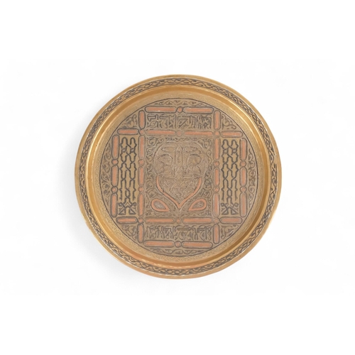 85 - An early 20th century Ottoman brass tray - circular and inlaid with white metal and copper, 34cm dia... 