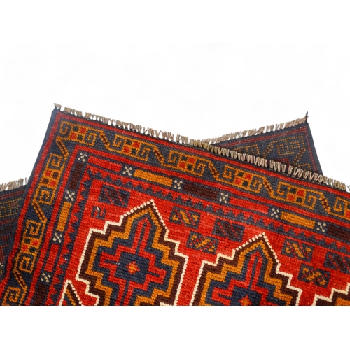 865 - A Baluchi rug - 134 x 80cm.