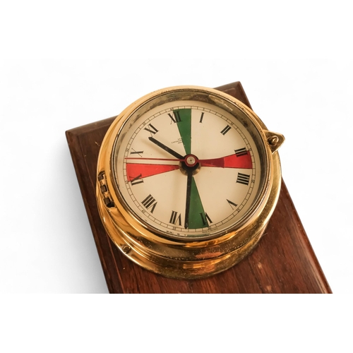 884 - A 20th century brass bulkhead Radio Room clock - marked with green and red radio silence wedges, pai... 