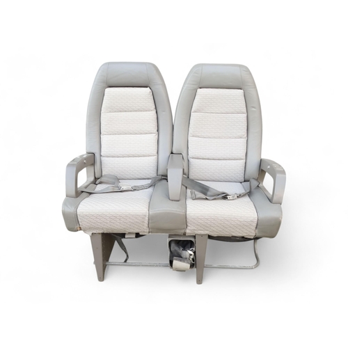 901 - A Siamese pair of aircraft seats from Concorde - in grey Connolly leather and cloth, with tilting ba... 