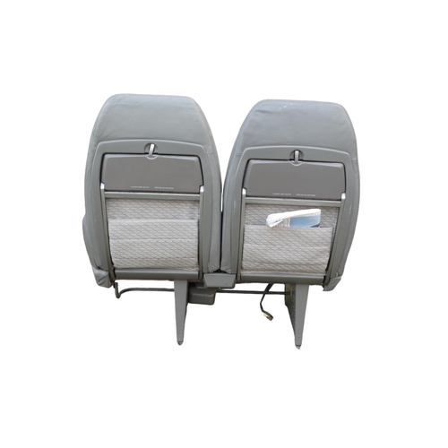 901 - A Siamese pair of aircraft seats from Concorde - in grey Connolly leather and cloth, with tilting ba... 