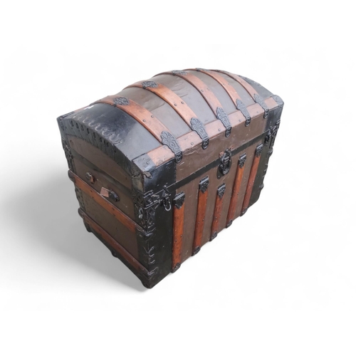 902 - A late 19th century domed trunk - tin on a wooden frame and lathes with steel brackets, 90 x 54 x 79... 