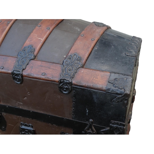 902 - A late 19th century domed trunk - tin on a wooden frame and lathes with steel brackets, 90 x 54 x 79... 