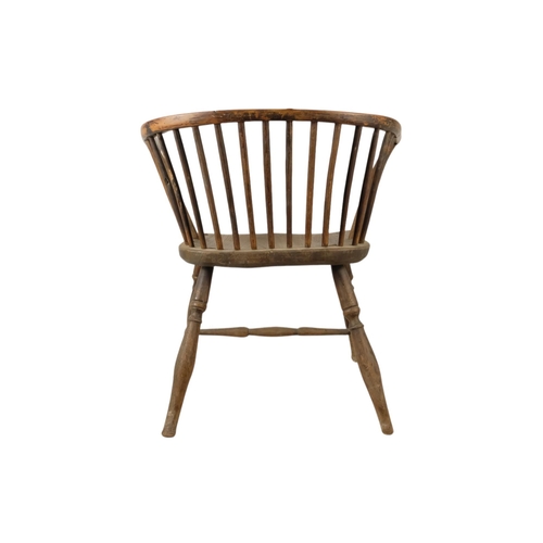 909 - A 19th century yew and elm Windsor chair - of a reduced stature, the contoured seat above turned leg... 