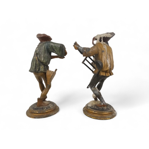 8 - A pair of late 19th century continental spelter candlesticks - modelled as grotesque jesters, 28cm h... 