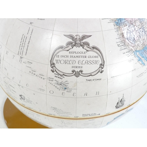 9 - A Replogle 'Franklin' globe - with relief features, metal base and meridian, 30cm diameter.