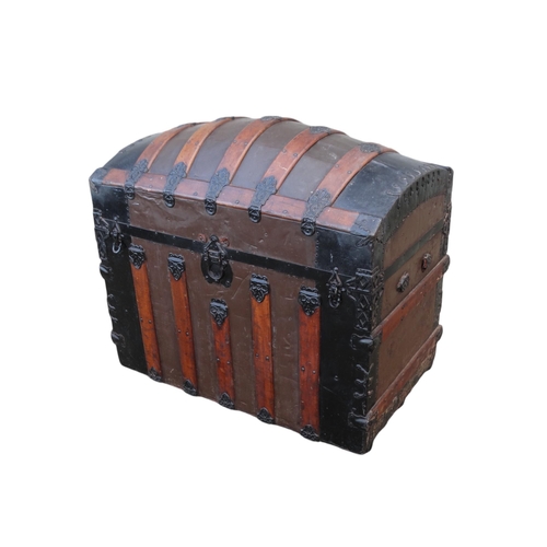 902 - A late 19th century domed trunk - tin on a wooden frame and lathes with steel brackets, 90 x 54 x 79... 