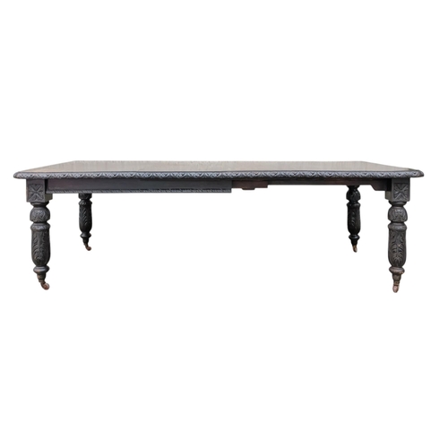 905 - A 17th century style oak extending dining table - with two leaf insertions, the rectangular top with... 