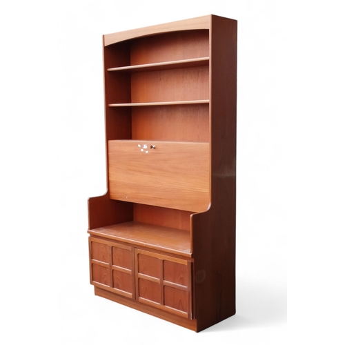 906 - A vintage teak secretaire bookcase in the manner of Ercol - with an arrangement of three shelves abo... 