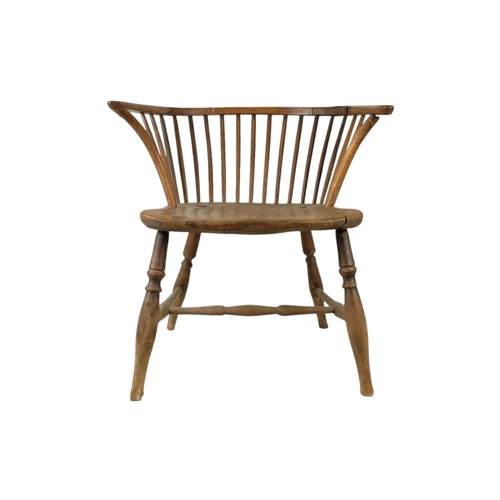 909 - A 19th century yew and elm Windsor chair - of a reduced stature, the contoured seat above turned leg... 