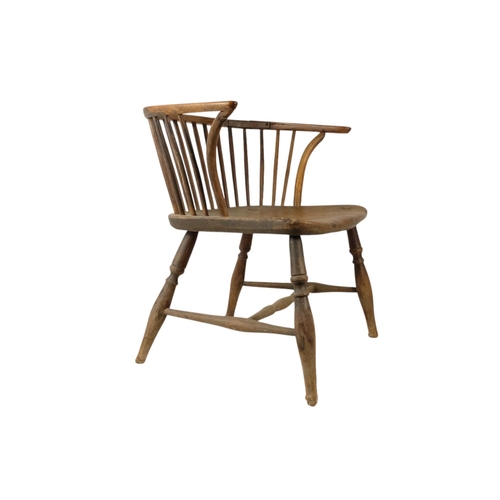 909 - A 19th century yew and elm Windsor chair - of a reduced stature, the contoured seat above turned leg... 