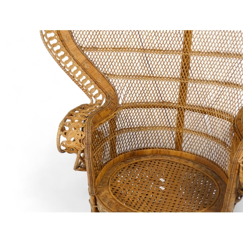 919 - A 1960s bamboo and rattan peacock chair with arched back - with a guilloche border, woven back panel... 