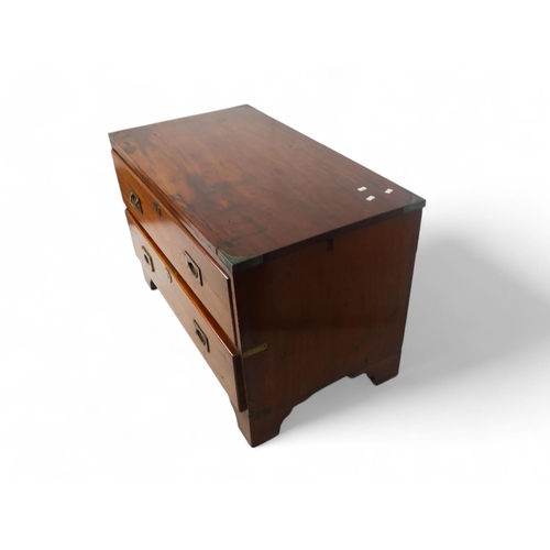 920 - A late Victorian camphorwood chest - rectangular with brass angle brackets and two graduated drawers... 