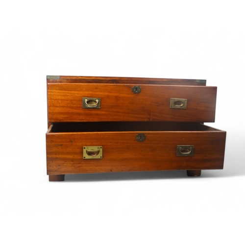 920 - A late Victorian camphorwood chest - rectangular with brass angle brackets and two graduated drawers... 