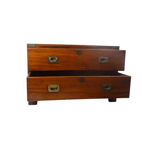 920 - A late Victorian camphorwood chest - rectangular with brass angle brackets and two graduated drawers... 