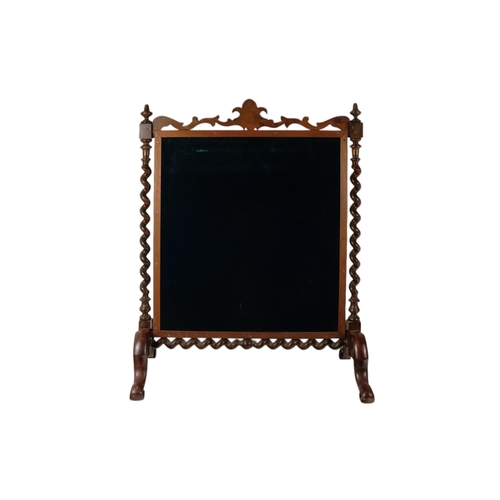 931 - A Victorian walnut fire screen - incorporating a Berlin work panel depicting children among castle r... 