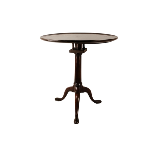 932 - A George III mahogany tilt top table - the circular dish moulded top above a birdcage and columnar s... 