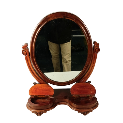 933 - A Victorian mahogany toilet mirror - the oval plate between curved supports, the base incorporating ... 