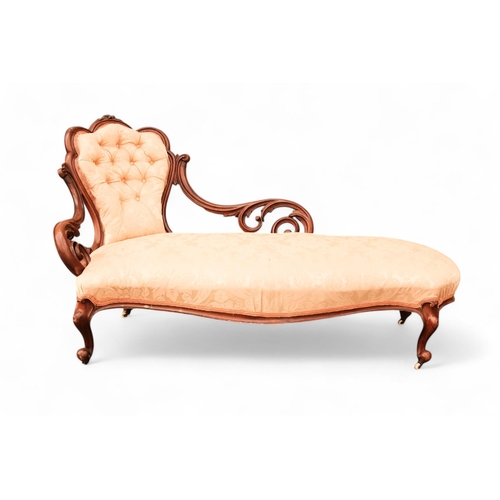 937 - A Victorian walnut and upholstered chaise longue - the button upholstered back with pierced foliate ... 