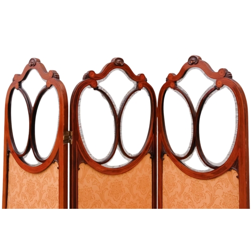 938 - An Edwardian mahogany three fold screen - the upper section with bevelled glazed panels and damask u... 