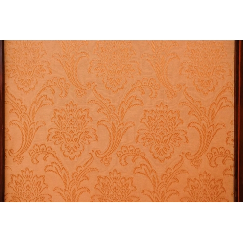 938 - An Edwardian mahogany three fold screen - the upper section with bevelled glazed panels and damask u... 