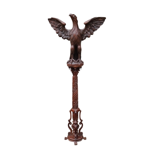 943 - A 20th century carved hardwood lectern - modelled as an eagle with wings outstretched, the support c... 