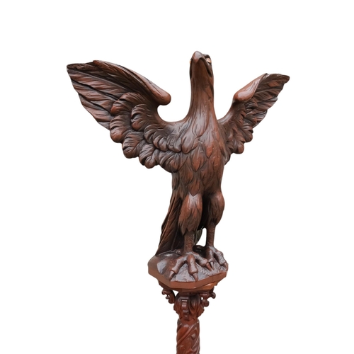 943 - A 20th century carved hardwood lectern - modelled as an eagle with wings outstretched, the support c... 