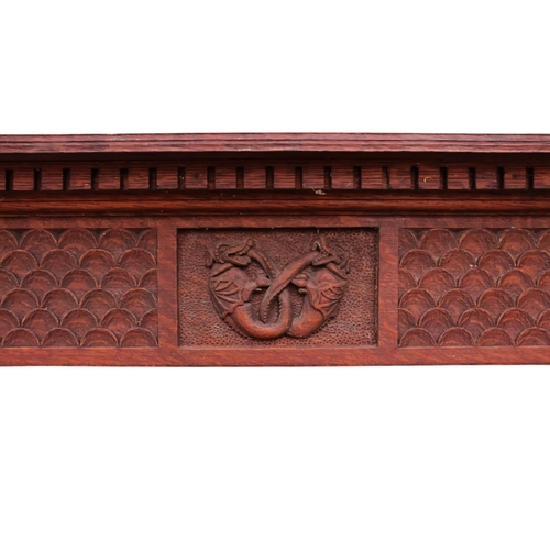 944 - A 17th century style oak hanging shelf - the carved cornice above four shelves with pierced end supp... 