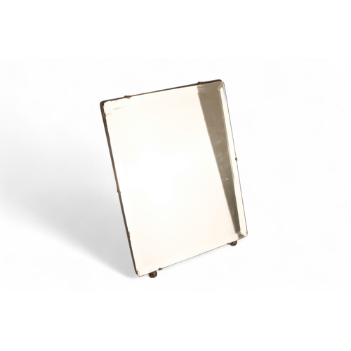 946 - An oak framed easel mirror - the rectangular plate with bevelled edge, height 48cm, width 36cm.