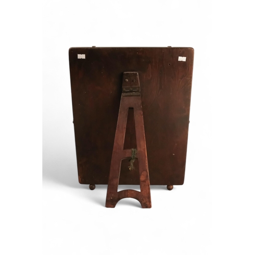 946 - An oak framed easel mirror - the rectangular plate with bevelled edge, height 48cm, width 36cm.