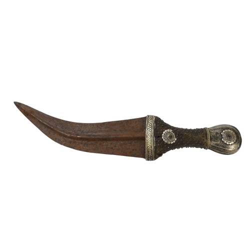 95 - A Middle Eastern Khanjar - the hardwood handle with copper studs and white metal fittings, the curve... 