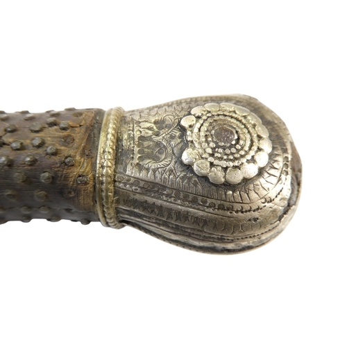 95 - A Middle Eastern Khanjar - the hardwood handle with copper studs and white metal fittings, the curve... 