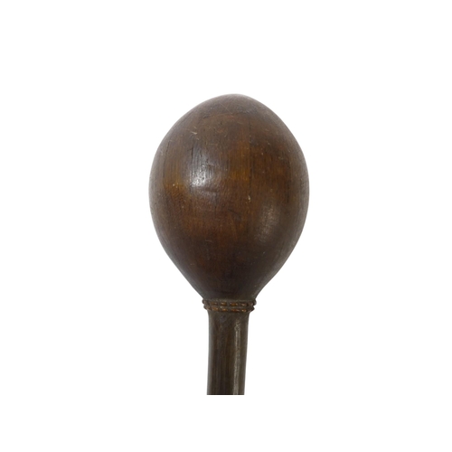 97 - A 19th century South Seas throwing club - with an egg shaped head featuring a carved collar, 34cm lo... 