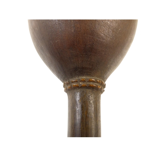 97 - A 19th century South Seas throwing club - with an egg shaped head featuring a carved collar, 34cm lo... 