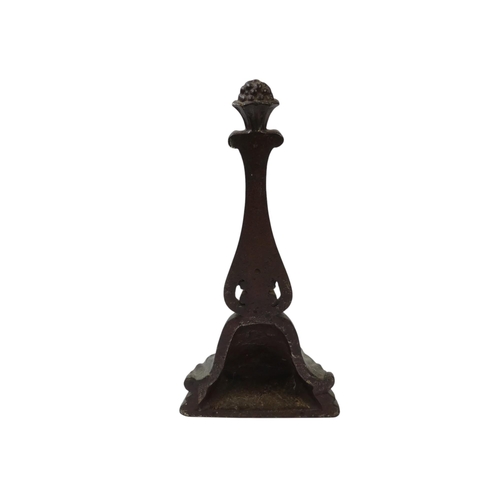 98 - A 19th century cast iron door-stop - of acanthus leaf form, 28cm high.