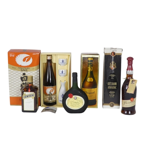 101 - A bottle of Cointreau - together with a bottle of Bisquit cognac, a bottle of Kressmann Armagnac, a ... 