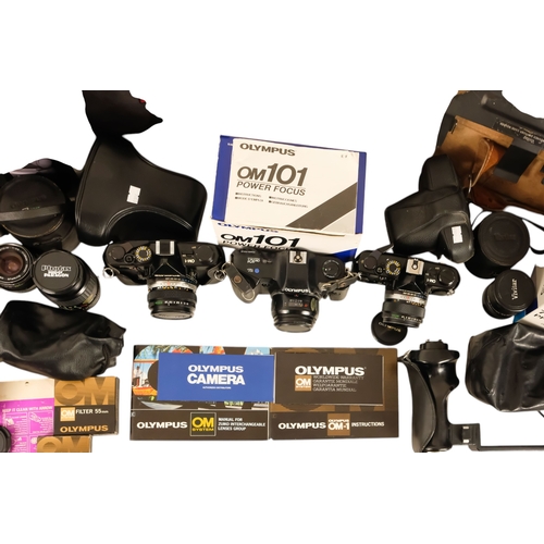 106 - A Olympus OM101 35mm film camera - boxed, together with two further OM1 camera's and a quantity of l... 