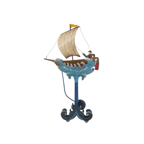 11 - A 20th/21st century weighted automaton vessel - polychrome painted in the form of a sailing boat wit... 