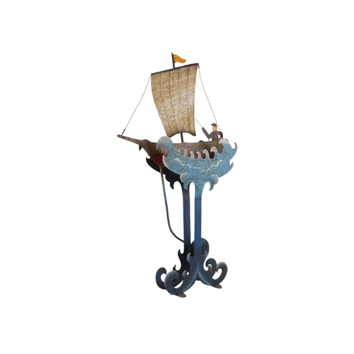 11 - A 20th/21st century weighted automaton vessel - polychrome painted in the form of a sailing boat wit... 