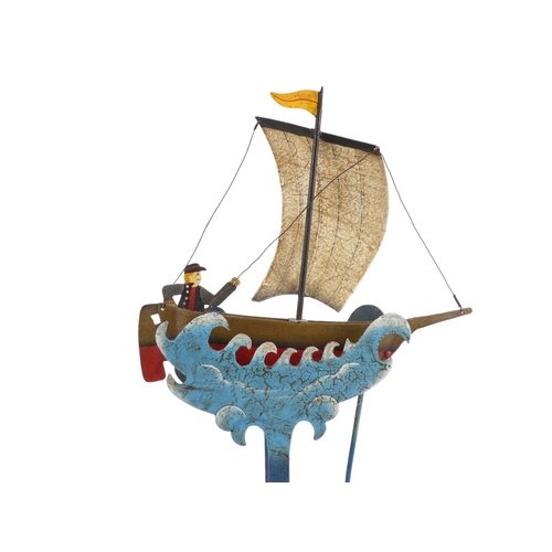 11 - A 20th/21st century weighted automaton vessel - polychrome painted in the form of a sailing boat wit... 